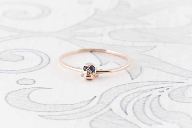 14K Rose Gold Moving Skull Ring with Sapphire Eyes image 1