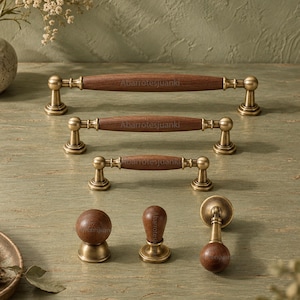 May include: A collection of cabinet hardware featuring three horizontal drawer pulls of varying lengths and three distinct knobs, all crafted with dark brown wood centers and brushed brass metal bases, each marked with the text Abarrotesjuanki.