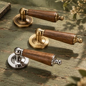 May include: Three door handles with wooden grips and metallic bases. Two handles feature a brushed brass finish, while one has a polished silver finish. Each handle is engraved with the text Abarrotesjuanki on the wooden section.