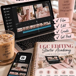 May include: A laptop displaying the CapCut video editing interface, a smartphone with the CapCut app, and a spiral-bound workbook titled UGC Editing Starter Academy. The scene includes a pink tumbler with text and a glass of coffee.