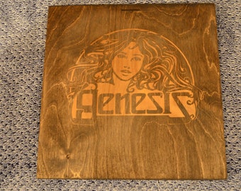 Genesis logo burned into wood