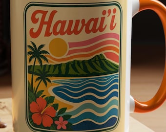 May include: A ceramic mug with an orange interior and handle, featuring a graphic print of a Hawaiian landscape with palm trees, a mountain, ocean waves, and hibiscus flowers, with the text Hawai'i written in a retro font at the top.