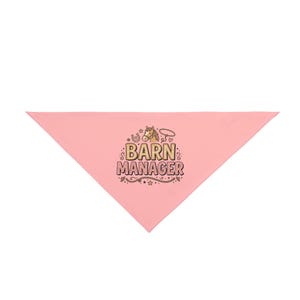 May include: A triangular light pink pet bandana featuring a central graphic of a brown horse head, a horseshoe, and a lasso. The text BARN MANAGER is printed in bold, blocky letters below the horse, surrounded by small stars and decorative swirls.