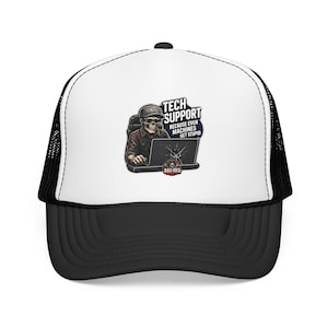 May include: A black and white trucker hat featuring a graphic of a skeleton wearing a cap and glasses while using a laptop. The text reads TECH SUPPORT BECAUSE EVEN MACHINES GET STUPID and includes a small circular logo labeled BAD IDEA.