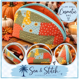 May include: A quilted clam shell cosmetic bag featuring a patchwork pattern of orange, yellow, and sage green floral fabrics. The bag has a light blue zipper closure and an orange interior lining. The text reads CLAM SHELL Cosmetic BAG and Sea & Stitch.