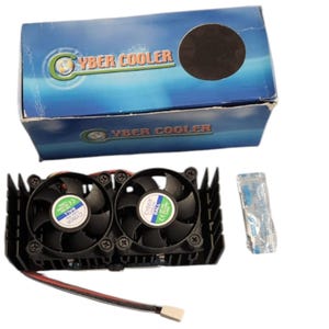 May include: A dual-fan computer cooling unit with black blades and a black heatsink, accompanied by its blue and white retail box labeled "CYBER COOLER" and a small sealed packet of thermal compound with a power cable and white connector.
