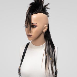Textured brown mix mohawk wig with lifted spikes and braid detailing, viewed from an upper front angle