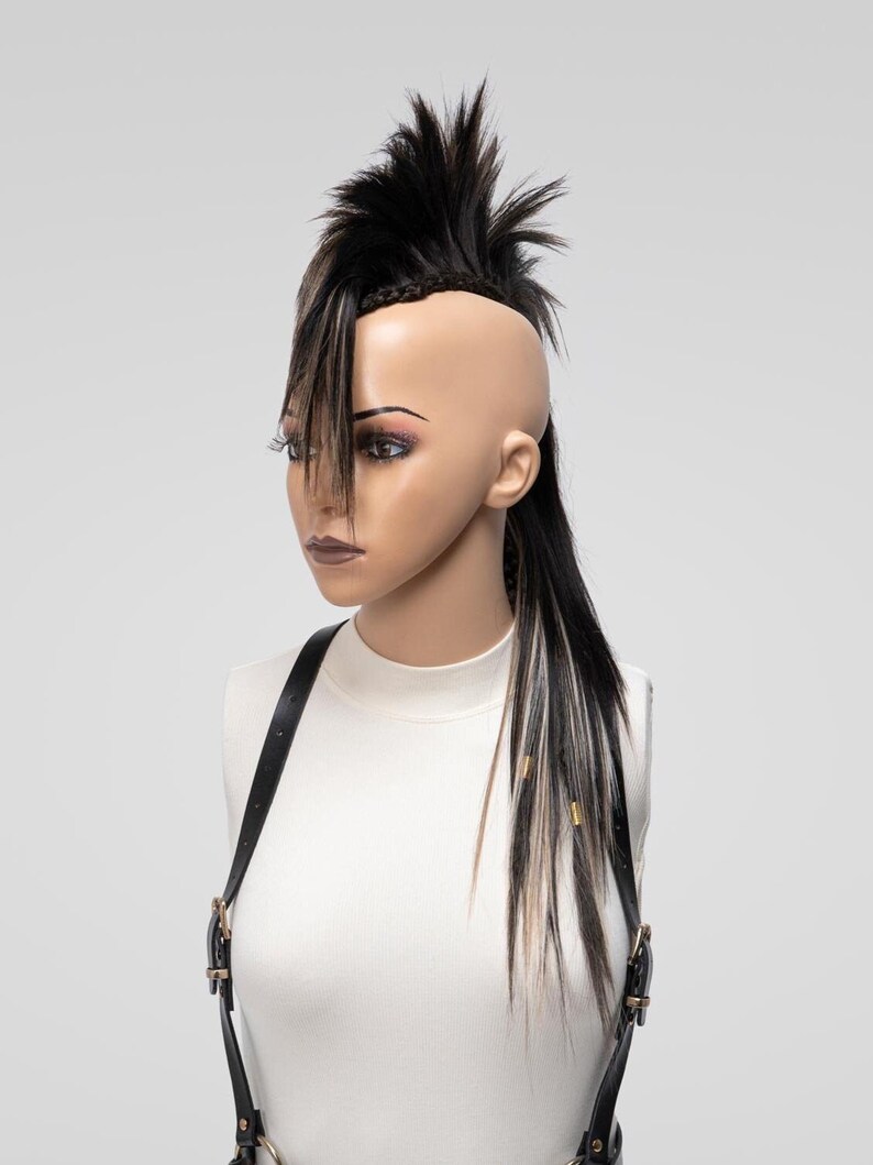Textured brown mix mohawk wig with lifted spikes and braid detailing, viewed from an upper front angle