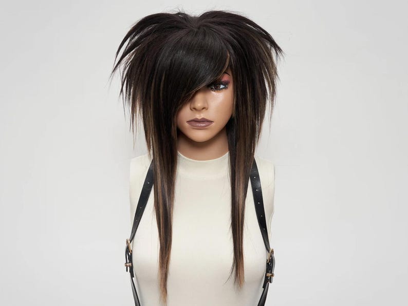 Scene hair wig in dark brown with light brown highlights, voluminous teased top, sharp layers, goth punk cosplay wig, synthetic hairpiece for alternative style, unisex fashion wig.