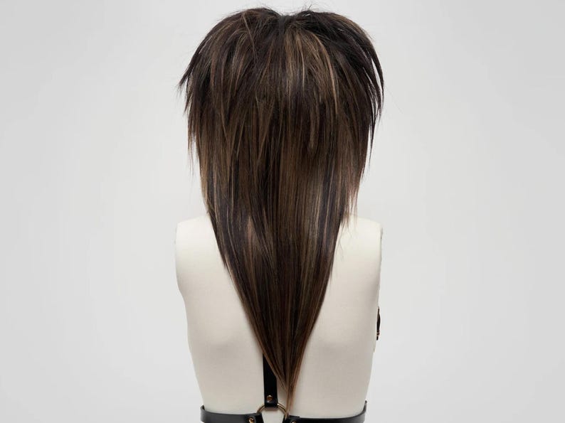 Shaggy layered emo scene wig in dark brown and light brown, long V-cut back, synthetic fiber hair, textured unisex hairstyle, cosplay and gothic fashion accessory.