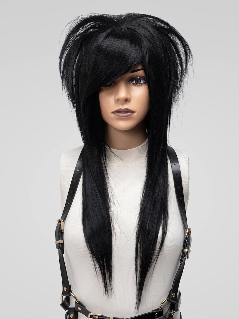 Black synthetic wig with side bangs and long layers styled in emo scene hair, ideal for cosplay, alternative fashion, and full-density hair replacement.