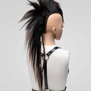 Back view of a long brown mix mohawk wig with high volume and detailed side braids