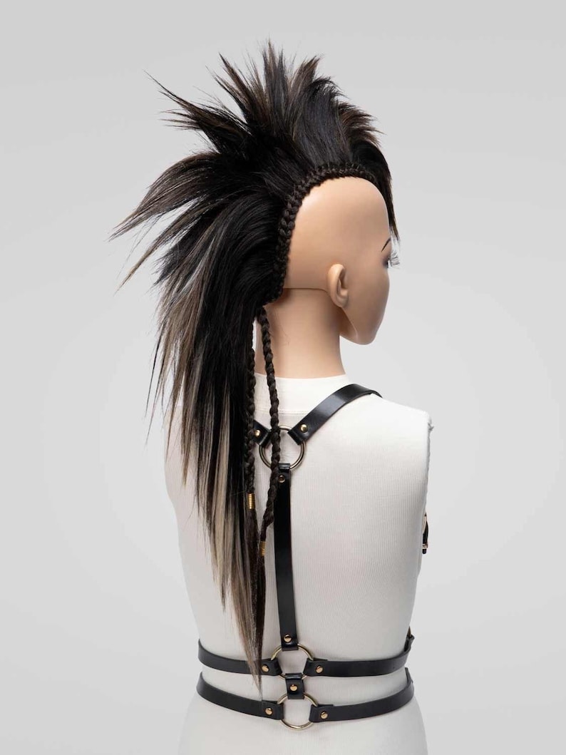 Back view of a long brown mix mohawk wig with high volume and detailed side braids
