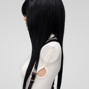 Side profile of long black alternative wig with side-swept fringe and choppy emo layers, perfect for scene hairstyle, men's cosplay wig, or hair loss coverage.