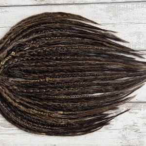 Close-up of crocheted DE faux dread extensions showing detailed texture and handcrafted finish. Features natural fibers and smooth-to-bumpy surface for realistic appearance. Custom length and SE option available. Perfect for gothic, bohemian, or Viking-inspired hairstyles.