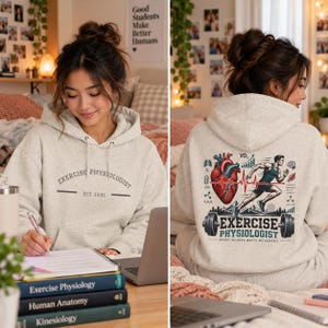 May include: A light gray hooded sweatshirt featuring the text "EXERCISE PHYSIOLOGIST EST. 1995" on the front. The back displays a graphic of a human heart, a running person, a barbell, and the text "EXERCISE PHYSIOLOGIST WHERE SCIENCE MEETS MOVEMENT."