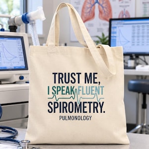 May include: A beige canvas tote bag featuring the dark blue and light blue text "TRUST ME, I SPEAK FLUENT SPIROMETRY." with a light blue EKG line graphic between the words and the word "PULMONOLOGY" printed in dark blue at the bottom.
