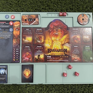 May include: A light green board game organizer tray containing a Barbarian character dashboard, various game cards with illustrations, a health tracker, a combat point dial, and several red six-sided dice with heart and sword symbols.