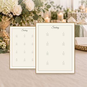May include: Two rectangular seating chart templates with a cream background, thin gold borders, and the word Seating in a script font at the top. The charts feature numbered tables with lists of names printed in black ink on a clean, white surface.