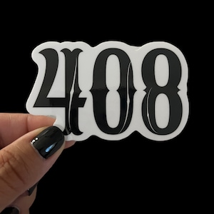 May include: White sticker with black text that reads "408" in a stylized font.