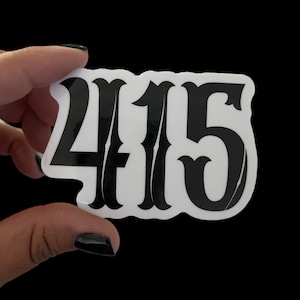 May include: A white sticker with black lettering that reads "415". The numbers are in a stylized font.