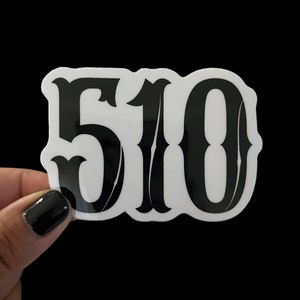 May include: White sticker with black bold lettering that reads "510".