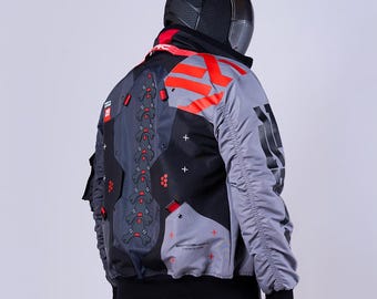 May include: A grey and black bomber jacket featuring a red spine-like graphic on the back, red geometric accents, and white plus signs. The jacket includes black ribbed cuffs, a high collar, and the text "TECH WEAR" and "GEARSHIFT" printed on it.