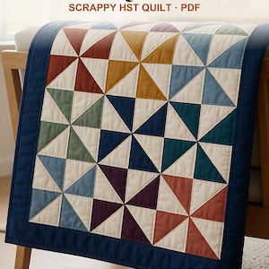 May include: A Pinwheel Quilt Pattern PDF for a scrappy HST quilt featuring a multi-colored pinwheel design with cream, navy, rust, mustard, sage, and purple triangles. The quilt has a solid navy blue border and includes 4 sizes in inches.
