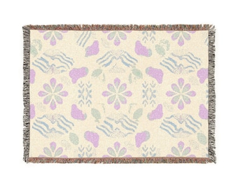 Manta tejida con estampado floral en tonos pastel / Manta con flecos 100% algodón