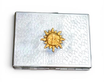 Estuche antiguo de latón con forma de sol para porros