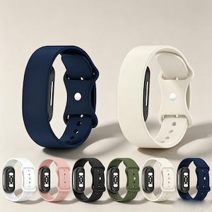 May include: Two large silicone watch bands in navy blue and off-white are displayed prominently. Below them, a row of six smaller watch bands in white, light pink, black, olive green, cream, and navy blue are shown with black tracker modules.