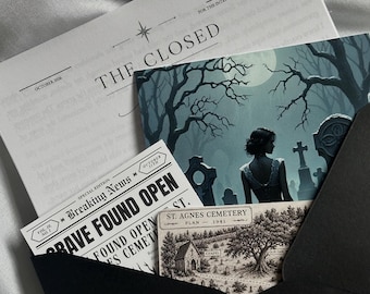 May include: A black envelope containing several printed items: a document titled THE CLOSED, a card showing a person in a cemetery under a full moon, a newspaper clipping with the headline GRAVE FOUND OPEN, and a map labeled ST. AGNES CEMETERY PLAN 1941.