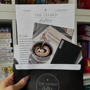 May include: A black envelope featuring a circular logo with the text The Closed Letter, containing a white letter with the header The Closed Letter, a square card depicting a steaming cup of coffee, and a small black card labelled Confidential.
