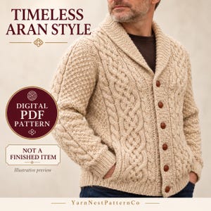 May include: A beige cable-knit cardigan with a shawl collar and brown buttons. Text on the image reads: TIMELESS ARAN STYLE, DIGITAL PDF PATTERN, NOT A FINISHED ITEM, Illustrative preview, and YarnNestPatternCo.
