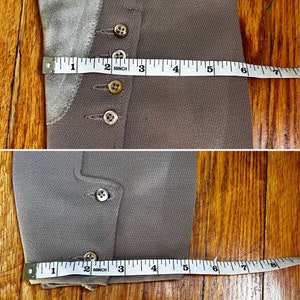 May include: A brown pair of riding breeches with a suede knee patch and multiple buttons. The breeches are measured with a tape measure, showing a length of 7 inches.