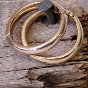 VintageTrifari gold colored metal hoops, circa 1950s