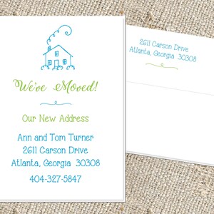 May include: A green and blue moving announcement card with a simple house illustration. The text reads "We've Moved!" and includes the new address: Ann and Tom Turner, 2611 Carson Drive, Atlanta, Georgia 30308, 404-327-5847.