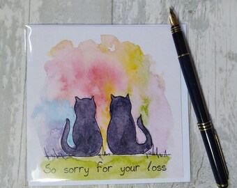 May include: A watercolor painting of two black cats sitting back to back against a colorful background. The text "So sorry for your loss" is written below the cats.