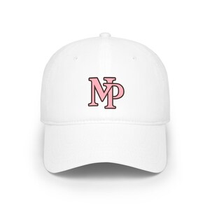 May include: A white baseball cap featuring a centered graphic of the letters MP in light pink with a dark brown outline. The cap has a structured crown, a curved brim, and a button at the top center, providing a clean and simple design.