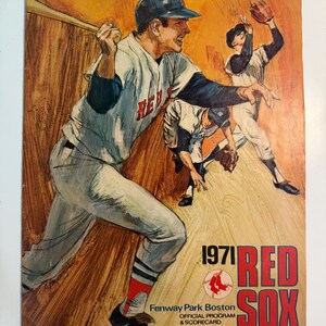 May include: A 1971 Boston Red Sox official program and scorecard featuring a painted illustration of baseball players in white uniforms with red lettering. The cover includes the text 1971 RED SOX, Fenway Park Boston, and TWENTY FIVE CENTS.