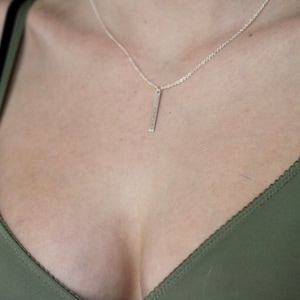 May include: A set of three ceramic mugs with a speckled, matte finish. The mugs are in shades of cream, light gray, and dark gray. Each mug has a simple, minimalist design, perfect for coffee or tea.