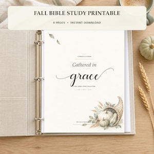May include: A white paper sheet inside a metal ring binder featuring the text "Gathered in grace" and "A FALL BIBLE STUDY COLLECTION" with a watercolor illustration of a cornucopia filled with pumpkins, wheat, and leaves at the bottom.