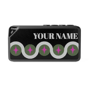 May include: A rectangular black Bluetooth speaker featuring a white wavy line pattern across the front, interspersed with olive green circles and bright pink four-pointed stars. The text YOUR NAME is printed in white on the upper section.