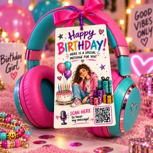 May include: Bright pink and teal over-ear headphones with a hanging rectangular gift tag. The tag features the text Happy Birthday, an illustration of a person with a cake and gifts, and a QR code with the text Scan here to hear my message.