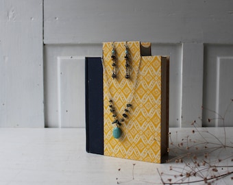 ONE Necklace Book Bust - Yellow Floral with Dark Blue Binding - Colorful Patterned Display - Necklace Hook Earring Display Photo Prop