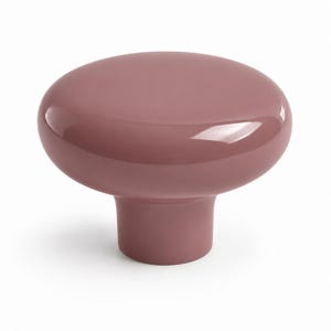 May include: A solid, dusty rose-colored cabinet knob with a smooth, glossy finish. The knob features a wide, rounded, mushroom-shaped top that tapers down into a cylindrical base, creating a simple, uniform, and reflective surface throughout.