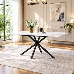 May include: A rectangular dining table featuring a white faux marble top with grey veining and a black metal base with six angled legs that meet at a central point. The table surface is smooth and reflective, providing a clean, modern aesthetic.