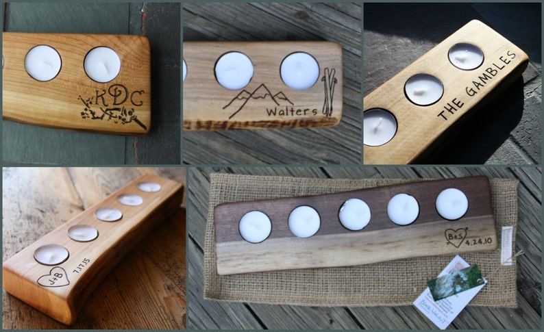 May include: Five wooden candle holders with various engravings. The holders are made of natural wood with a light brown color. The engravings include names, dates, and designs like mountains and ski poles.