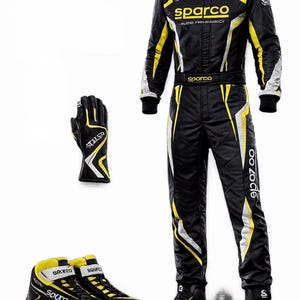 May include: A black racing suit with yellow and white accents, featuring the Sparco logo on the chest, belt, and collar. Includes a matching black, yellow, and white racing glove and a pair of black, yellow, and white high-top racing shoes.