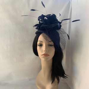 dark navy sinamay wedding half hat with netting veil, long floating feathers and ruffle straw accent